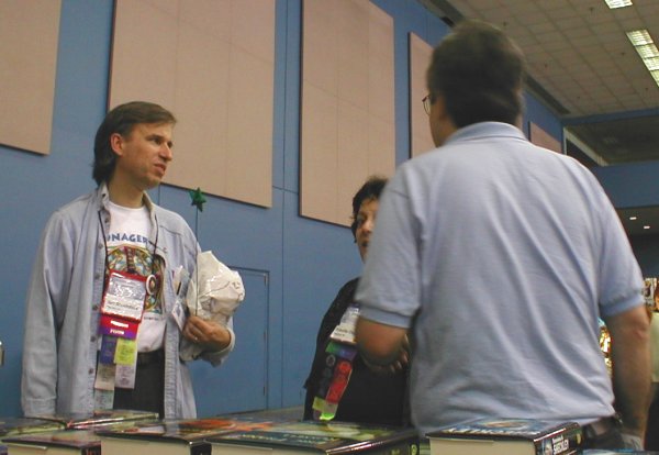 Ian Stockdale Finally Visits the Dealers Room, Commiserating with Program Gurus Priscilla Olson and Jim Mann